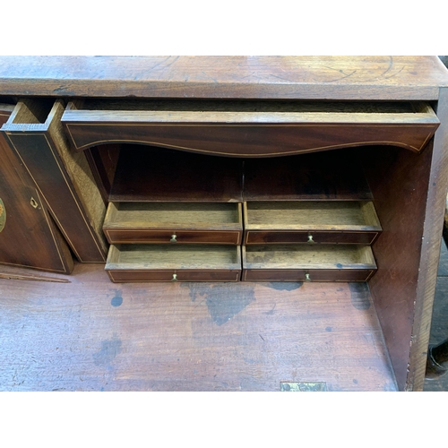 58 - A George III mahogany bureau on bracket supports - approx. 108cm high x 112cm wide x 54cm deep