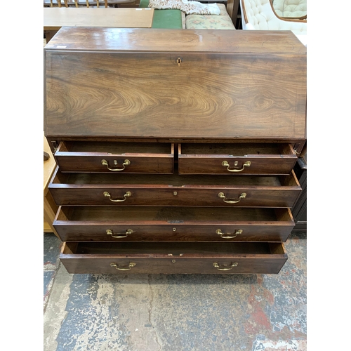 58 - A George III mahogany bureau on bracket supports - approx. 108cm high x 112cm wide x 54cm deep