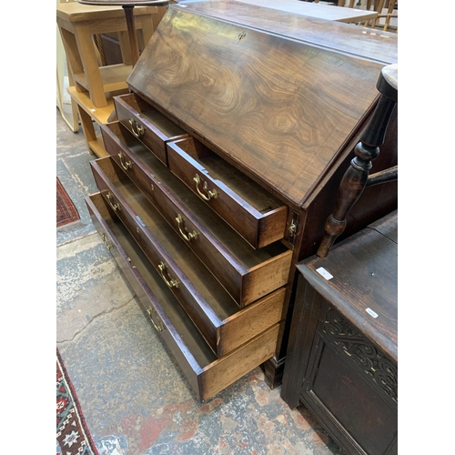 58 - A George III mahogany bureau on bracket supports - approx. 108cm high x 112cm wide x 54cm deep