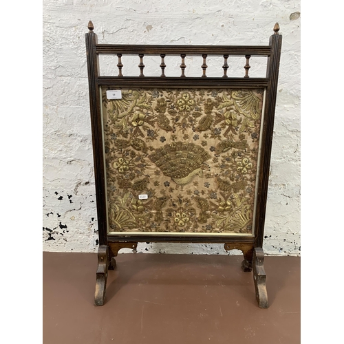 59 - An early 20th century beech framed embroidered fire screen - approx. 72cm high x 48cm wide