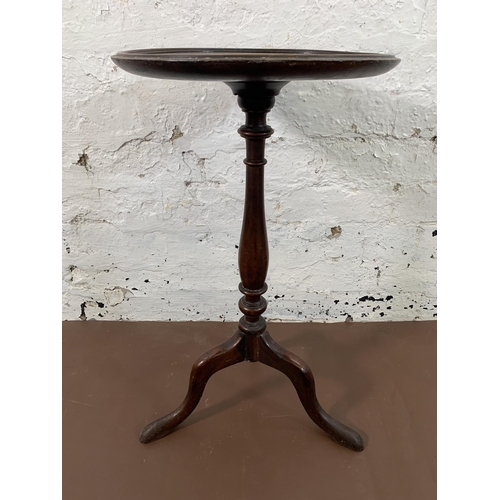 60 - A Georgian mahogany circular tripod wine table - approx. 60cm high x 34cm diameter