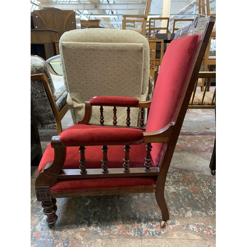 64 - A late Victorian/Edwardian carved mahogany and red fabric upholstered parlour chair on castors - app... 