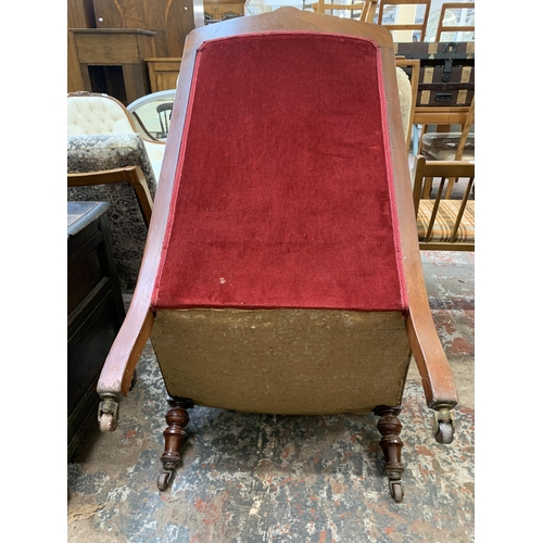 64 - A late Victorian/Edwardian carved mahogany and red fabric upholstered parlour chair on castors - app... 