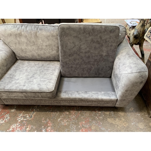 69 - A modern grey fabric upholstered three seater sofa - approx. 92cm high x 193cm wide x 94cm deep