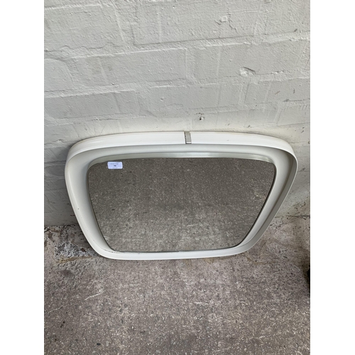 70 - A mid 20th century white plastic framed wall mirror - approx. 71cm high x 69cm wide