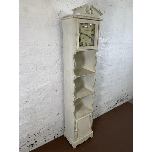 72 - A modern French style white painted clock bookcase - approx. 170cm high x 36cm wide x 26cm deep