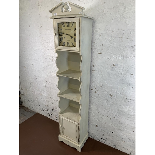 72 - A modern French style white painted clock bookcase - approx. 170cm high x 36cm wide x 26cm deep