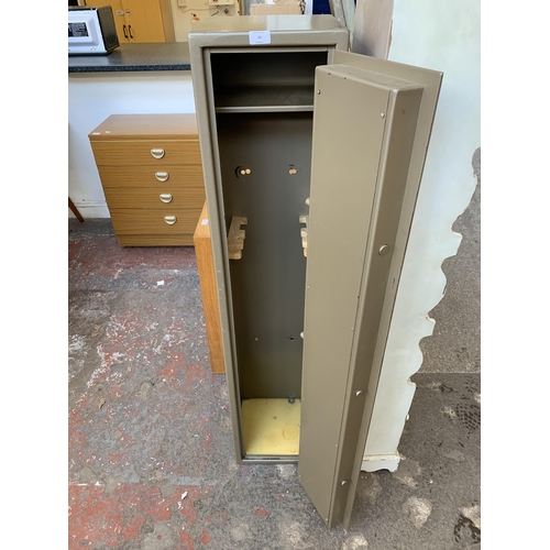 73 - A Goliath metal gun cabinet (key in office) - approx. 145cm high x 30cm wide x 28cm deep