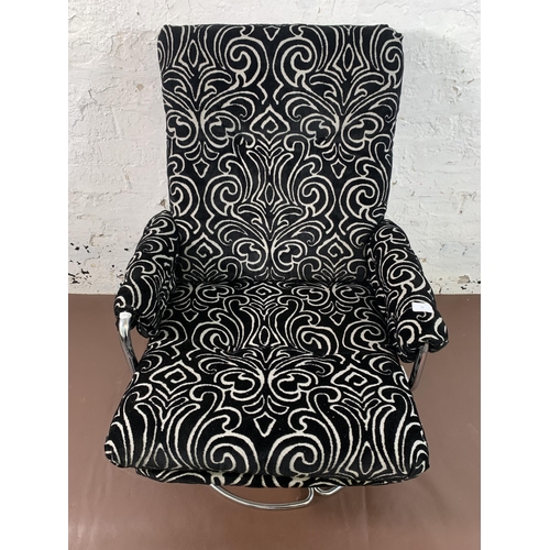 74 - A mid 20th century chrome plated and fabric upholstered swivel armchair - approx. 93cm high x 67cm w... 