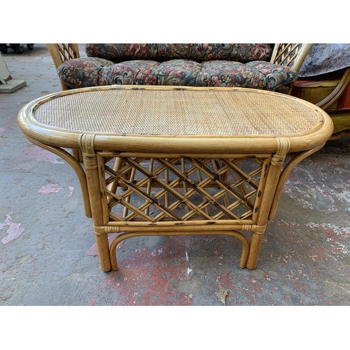 77 - A wicker and cane two piece conservatory suite comprising two seater sofa and coffee table