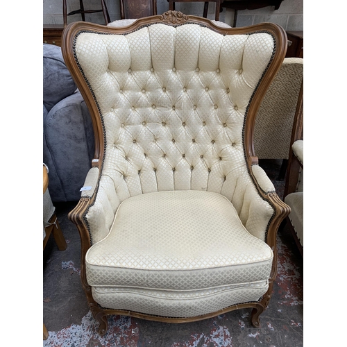 82 - A French Louis XV style beech framed and fabric button back upholstered armchair - approx. 109cm hig... 