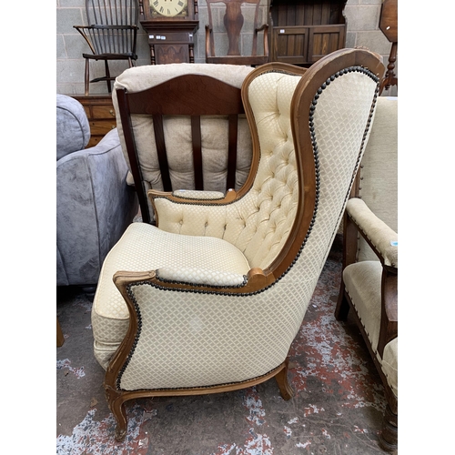 82 - A French Louis XV style beech framed and fabric button back upholstered armchair - approx. 109cm hig... 