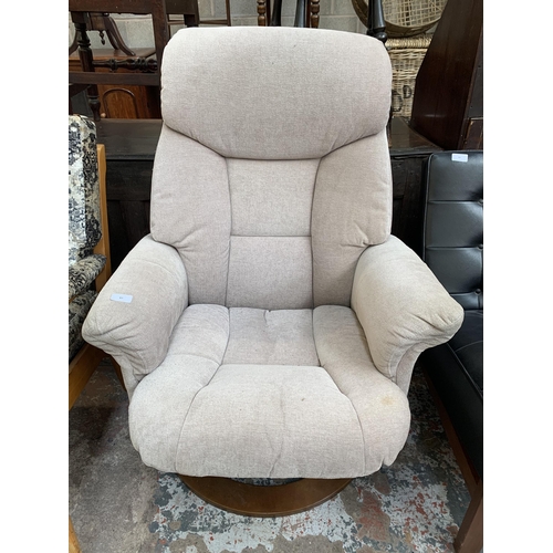 87 - A Global Furniture Alliance Ltd fabric upholstered swivel armchair