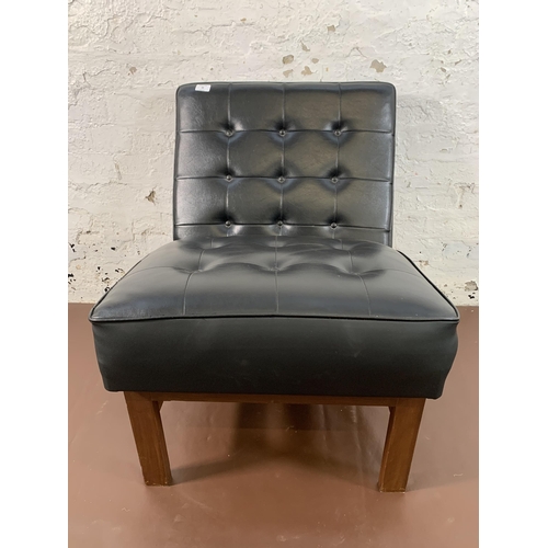 88 - A mid 20th century teak and black vinyl lounge chair - approx. 74cm high x 60cm wide x 68cm deep