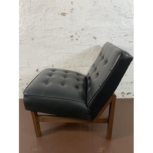 88 - A mid 20th century teak and black vinyl lounge chair - approx. 74cm high x 60cm wide x 68cm deep