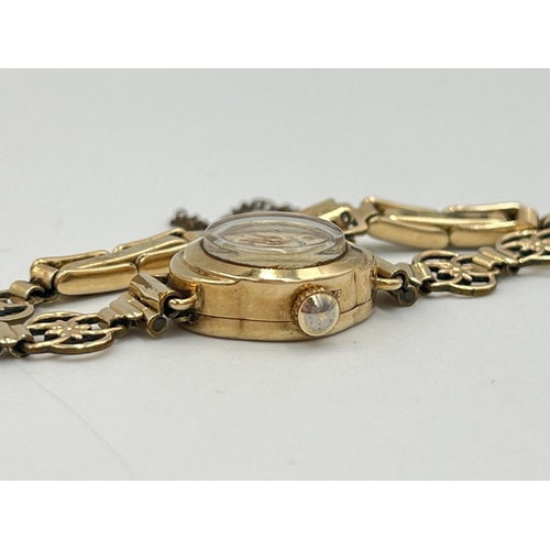 2300 - A mid 20th century hallmarked 9ct gold cased Regency mechanical lady's wristwatch on rolled gold bra... 