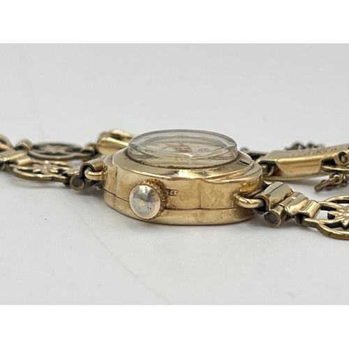 2300 - A mid 20th century hallmarked 9ct gold cased Regency mechanical lady's wristwatch on rolled gold bra... 