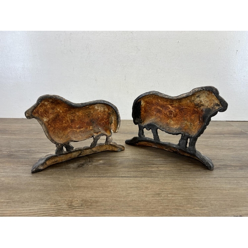 443 - A pair of 19th century style cast iron ram doorstops - approx. 19cm high x 24cm long