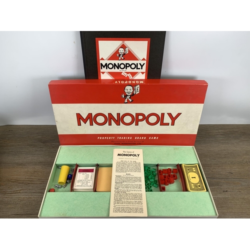 479 - A collection of vintage toys and games to include diecast model vehicles, Monopoly board game, playi... 