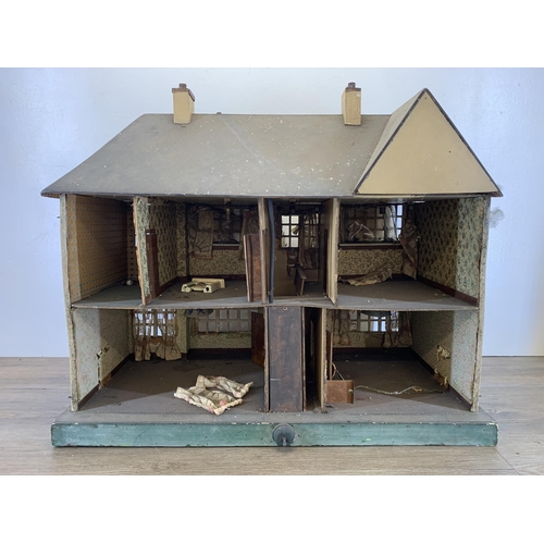 480 - An early 20th century handmade and painted two storey doll's house - approx. 61cm high x 71cm wide x... 