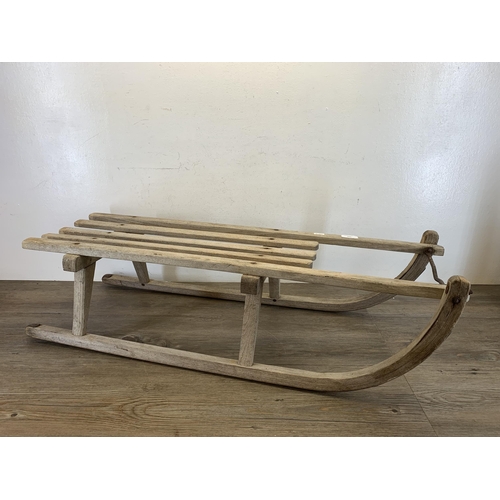 490 - A vintage wooden child's sledge