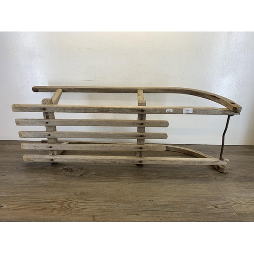 490 - A vintage wooden child's sledge