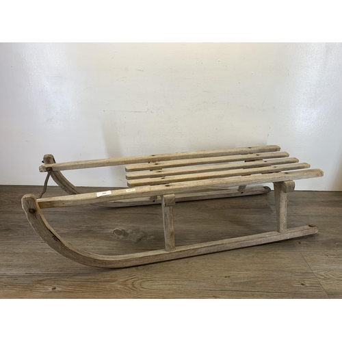 490 - A vintage wooden child's sledge