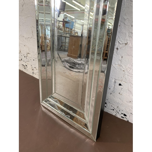 663 - A modern bevelled edge all hanging mirror - approx. 150cm high x 50cm wide