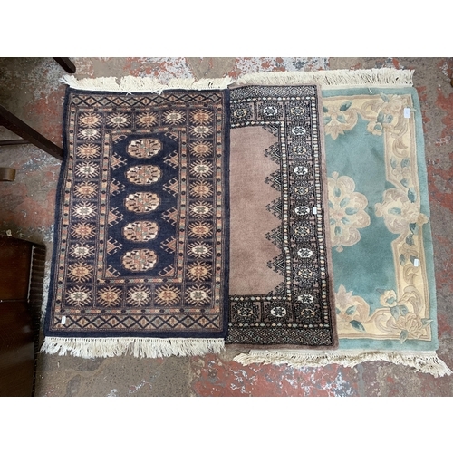 122 - Three rugs, one G.H.Frith Ltd. Pakistan Bokhara Blue - approx. 91cm x 61cm, one Frith Rugs Pakistan ... 