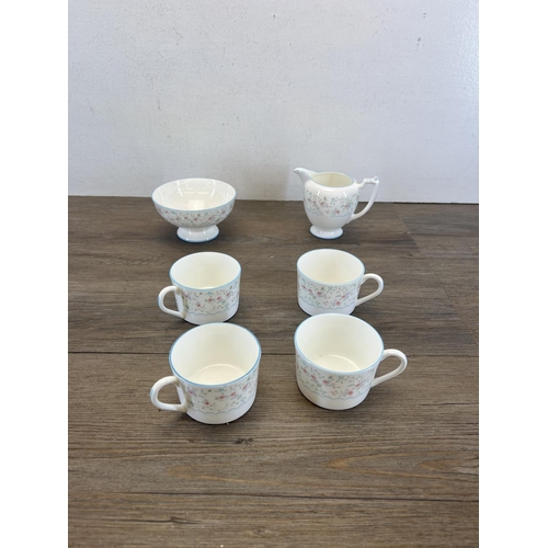 391 - A collection of Coalport Mignon bone china to include four cups, milk jug, sugar bowl etc.