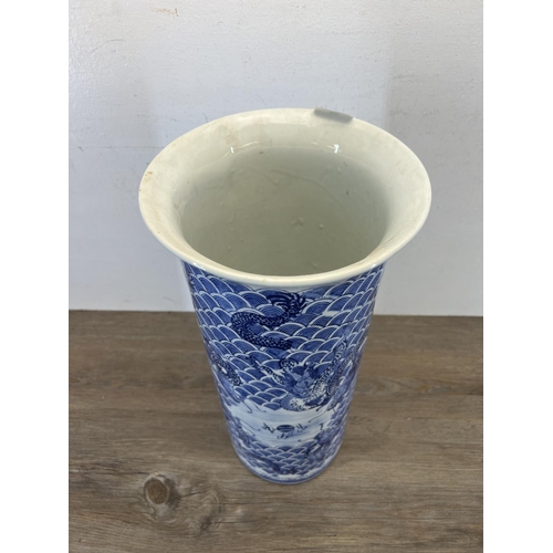 393 - A Chinese blue and white porcelain dragon pattern stick stand/vase - approx. 46cm high