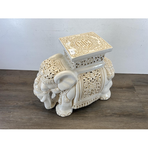 394 - A ceramic elephant jardinière stand - approx. 41cm high