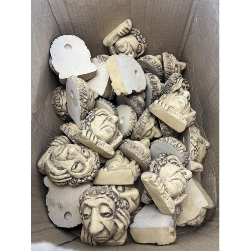 398 - A collection of plaster wall masks to include Oxford etc.