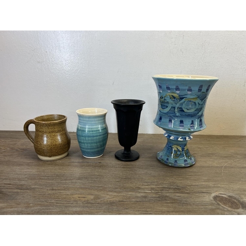 403 - A collection of ceramics and glassware to include Membury jugs, wall pocket, tiles etc.