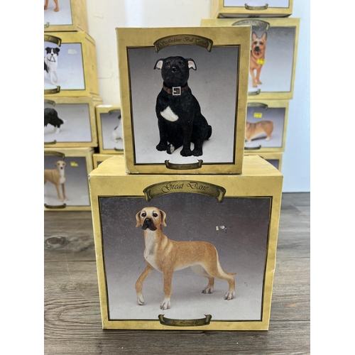 410 - Fifteen boxed The Leonardo Collection resin dog figurines