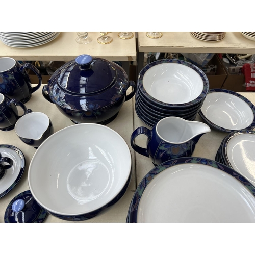 411 - A collection of Denby Baroque dinnerware to include seven cups, nine saucers, milk jug, tureen etc.