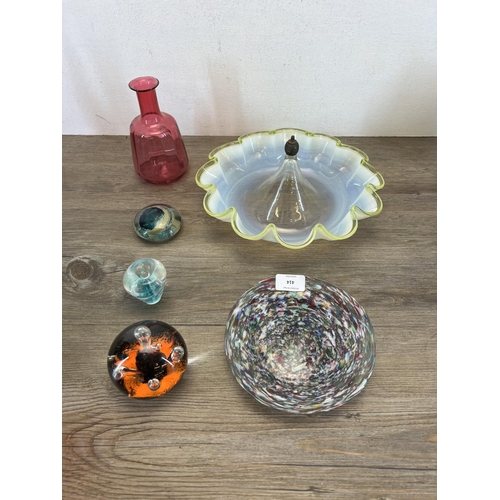 414 - A collection of glassware to include Caithness Moonflower paperweight, Victorian cranberry vase, vas... 