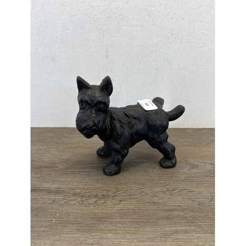 433 - A 19th century style cast iron scottie dog figurine