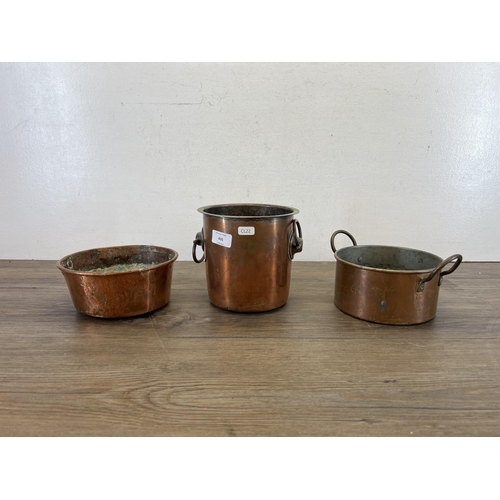 435 - Three pieces of 19th century copper, one two handled wine cooler, one two handled saucepan and one h... 