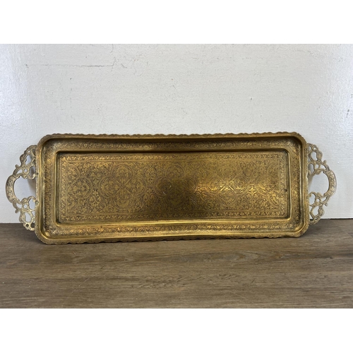 442 - Two antique brass serving trays, one engraved and one embossed