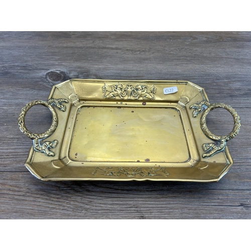 442 - Two antique brass serving trays, one engraved and one embossed