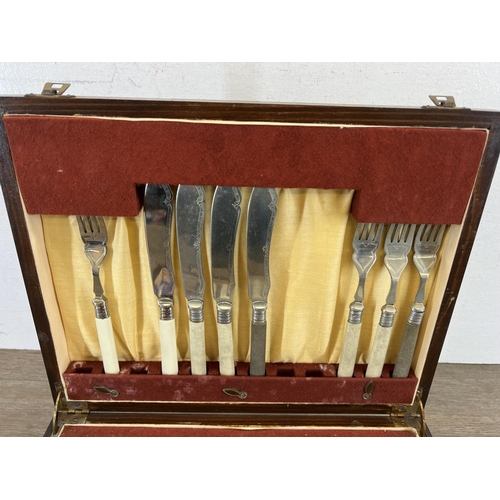 444 - A 1920s oak cased canteen of cutlery