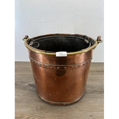 456 - A 19th century rivetted copper log bin with brass handle - approx. 30cm high x 34cm diameter