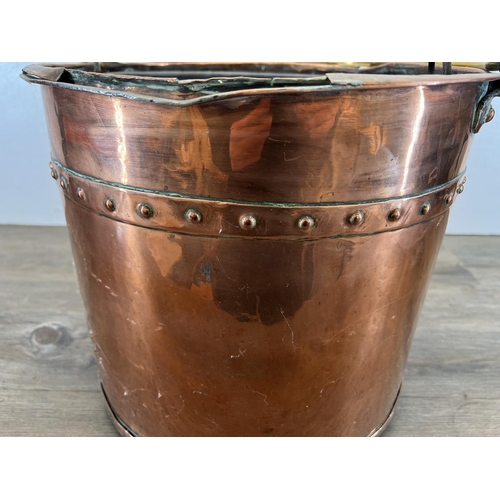 456 - A 19th century rivetted copper log bin with brass handle - approx. 30cm high x 34cm diameter