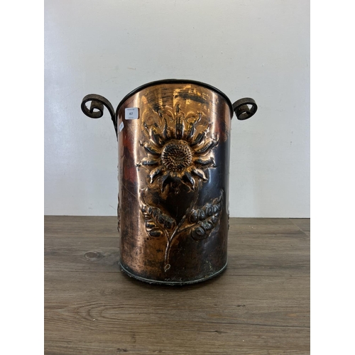 457 - An Arts & Crafts embossed copper coal bucket with wrought iron handle - approx. 40cm high