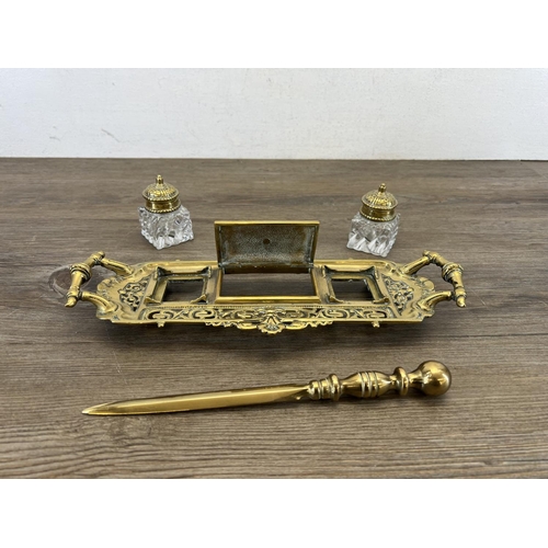 461 - A 19th century N.T. & S. brass twin handled inkwell stand with later associated brass letter opener