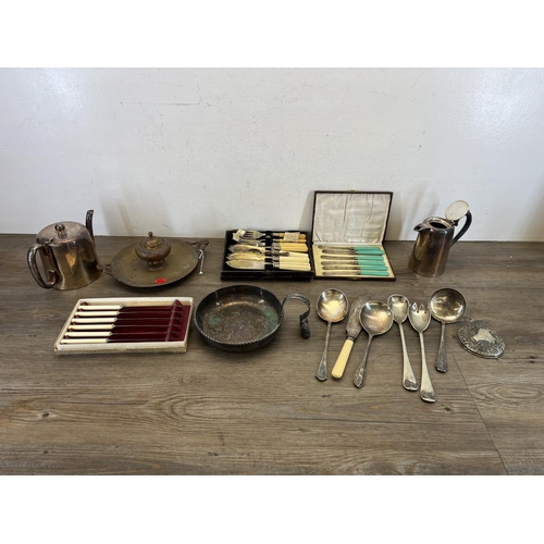 465 - A collection of vintage metalware to include cutlery, brass two handled inkwell with Greek key patte... 