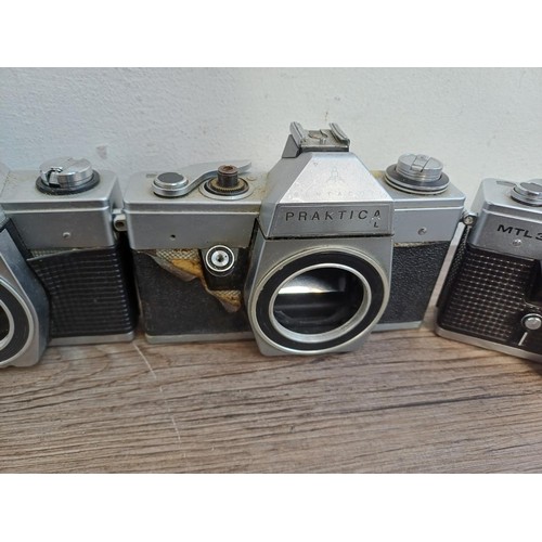 681 - Nine 35mm SLR camera bodies, eight Praktica and one Prinzflex 500E