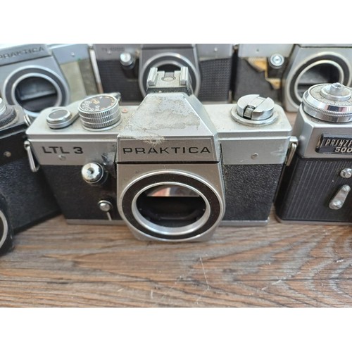 681 - Nine 35mm SLR camera bodies, eight Praktica and one Prinzflex 500E