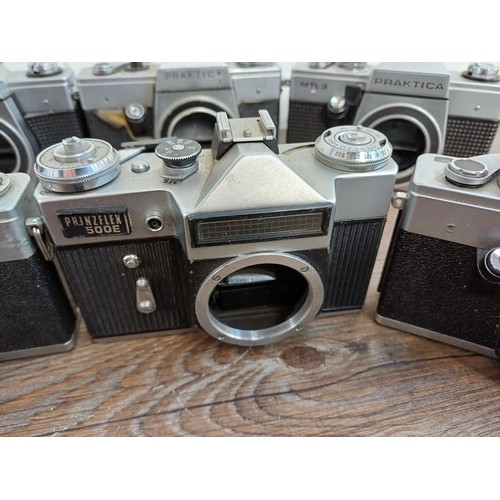 681 - Nine 35mm SLR camera bodies, eight Praktica and one Prinzflex 500E